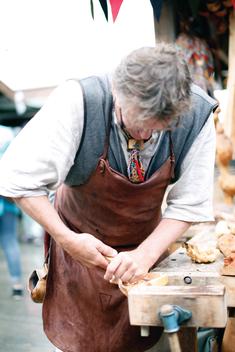 Carpenter at work on a market in Trondheim, Norway