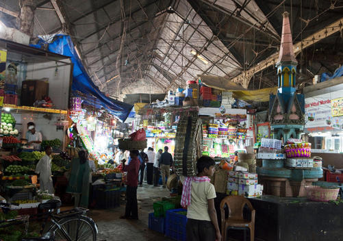 vendors and little shrine inside Bombay crawford market