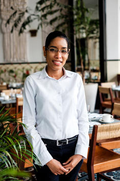 A waitress at the lobby restaurant of the American Trade Hotel in Casco Viejo in Panama City, Panama.