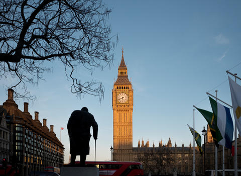 Houses of Parliament, Statue of Winston Churchill in Parliament Square, with Portcullis House on left