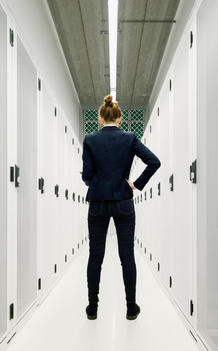 One employee standing in data storage room