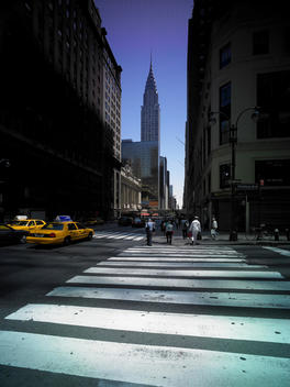 Low-Angle View Of Cross Walk With Chrysler Building In Background