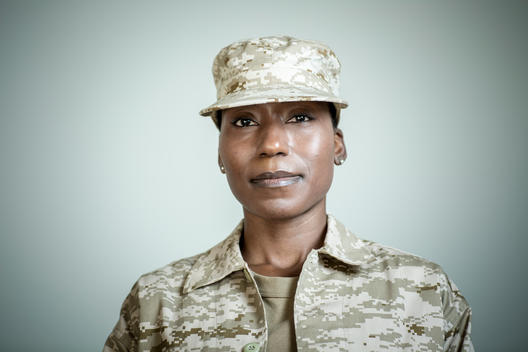 Studio portrait of confident female soldier