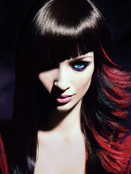 Beauty of brunette woman with cut bangs.