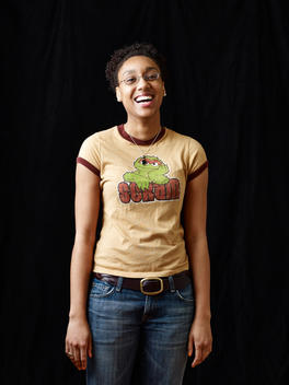 A portrait of a woman wearing a graphic t-shirt.