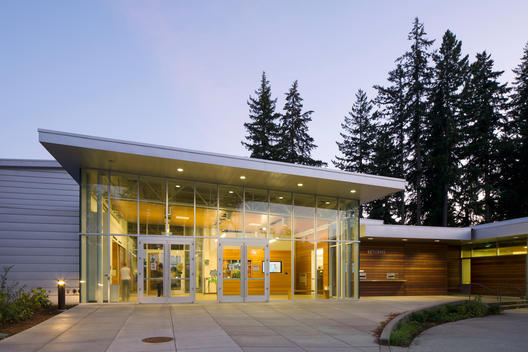 modern architecture exterior glass library building entry at dusk