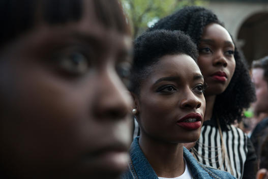 Three women listen to remarks during a Black Lives Matter gathering in Union Square Park.
