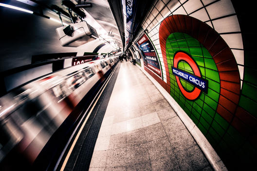 Tube Train departing Piccadilly Circus London Underground Station in London, England.