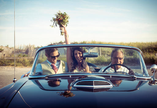 Bride and groom in vintage car