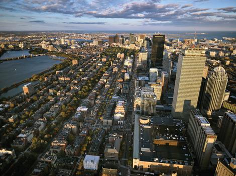 Arial shot of the City of Boston, MA, taken from a doors-off helicopter flying on a beautiful autumn afternoon.