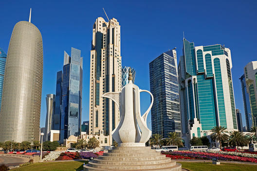 Statue of a traditional Arabian tea pot and modern architecture along the Al Corniche street in Doha Diplomatic district