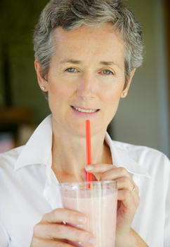 Woman Drinking Smoothie with Straw