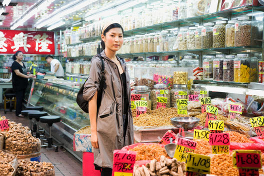 Asian woman shopping in grocery store