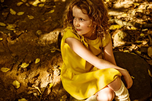 girl in the wood in yellow dress
