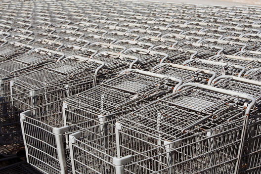 Large amounts of stacked shopping carts.