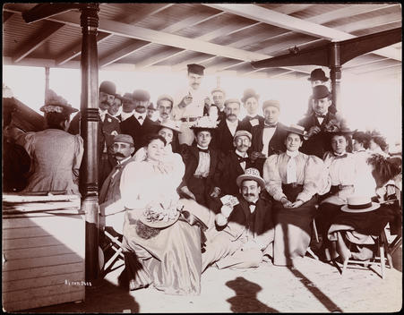 Passengers Posing For A Group Portrait Aboard A Hudson River Boat. It Is A Trip To Newburgh, N.Y. Sponsored By The Witmark Music Company. One Man Is Displaying His Playing Cards.