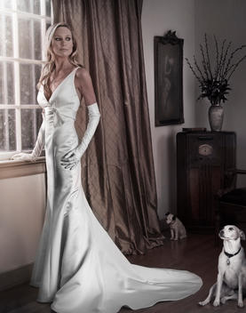 Caucasian woman in evening gown with dog