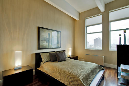 Small Immaculate Bedroom With Dark Furniture And Striated Wall Covering