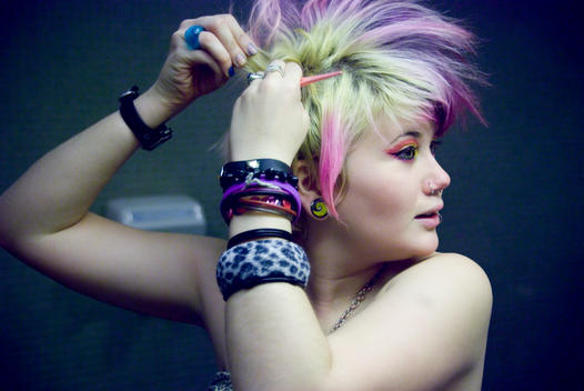 Portrait Of A Young Alternative Girl With A Colored Mohawk Getting Ready For The Day.