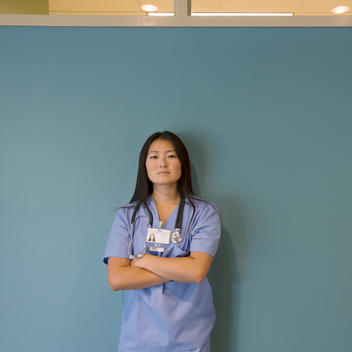 Japanese nurse standing in hospital