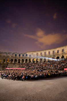 People Watching Outdoor Film At Night In Pula Arena Amphitheatre
