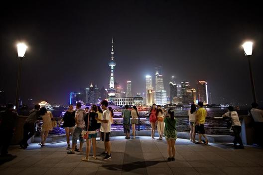 People photographing at the Bund in Shanghai at night
