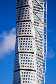 Turning Torso detail with cloud, Malm?, Sweden, designed by Santiago Calatrava.