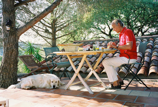 Man And Dog At Breakfast Table
