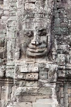 Detail of Buddha head made of stone at Bayon Temple