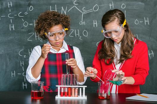Girls (9-10), (13-15) learning chemistry