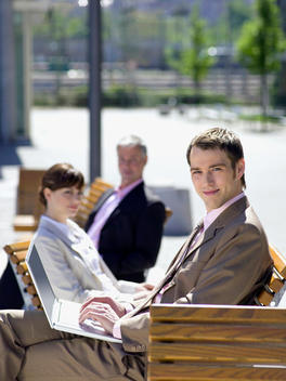 Germany, Baden-W?rttemberg, Stuttgart, Businesspeople with laptops, sitting out of doors