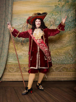 Actor dressed in old-fashioned costume on stage