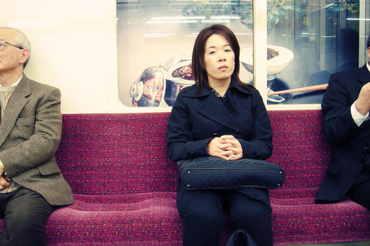 Japanese Woman Waiting For The Metro In Tokyo, Japan.