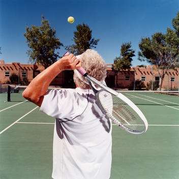 Tennis Player Serving On Court