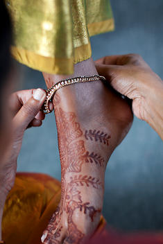 Close-up Indian bride's foot with henna and ankle bracelet