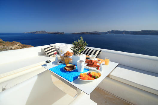 Breakfast table on balcony, Santorini, Cyclades Islands, Greece