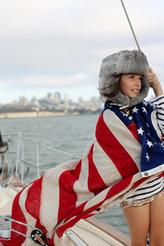 portrait of girl with American flag on boat