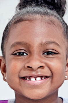 Girl Of African Ethnicity Smiling With Gap Tooth