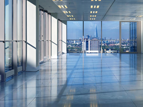 Empty office space with view of city from Exchange Tower, Docklands, London, England, UK