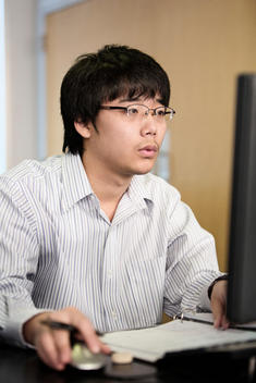 Asian student studying with computer