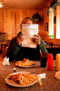 Man With Map In Diner