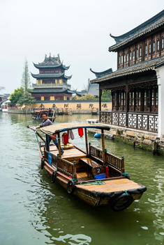 A boatman steers his boat down the canals of Zhujiajiao, a water town on the outskirts of Shanghai, China.