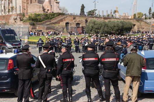Carabinieri agents outside the Colosseum. The Carabinieri is the fourth Italian military force charged with police duties under the authority of the Ministry of Defense. Carabinieri are the national gendarmerie of Italy, policing both military and civilia