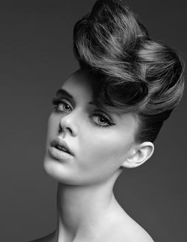 Portrait Of An Attractive Woman Modeling A Glamorous Hairstyle