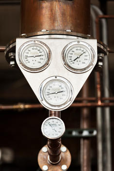Close-up pressure indicators in an artisanal distillery