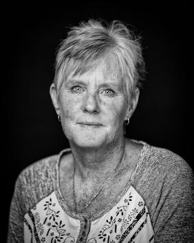 Black and white portrait of elderly woman short hair no smile