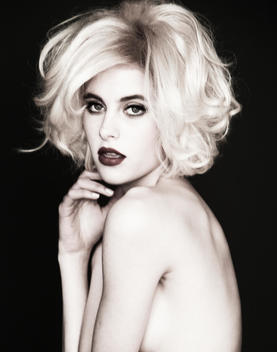 portrait of topless girl in blonde wig
