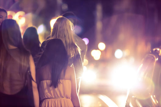 Girls walking in the street at night