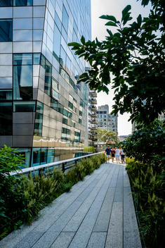 People walk along the Highline in New York City.