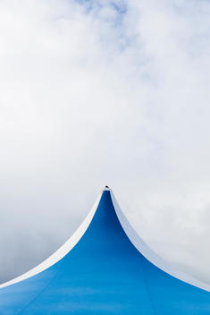 Top of a blue and white tent.